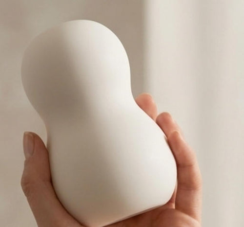 Wireless SYLAARA mini snowman-shaped vibration massager with portable design for personal care and relaxation.